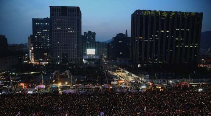 Protestors sing Christmas carols, demand Park’s removal