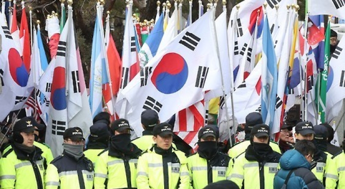 Park's supporters rally outside court as impeachment ruling nears