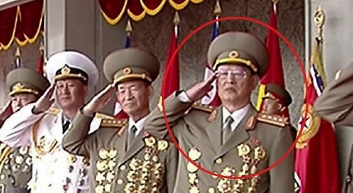 NK leader skips handshake with ex-spy chief at military parade, footage shows