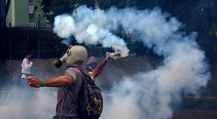 Boy, woman killed in Venezuela mass protests