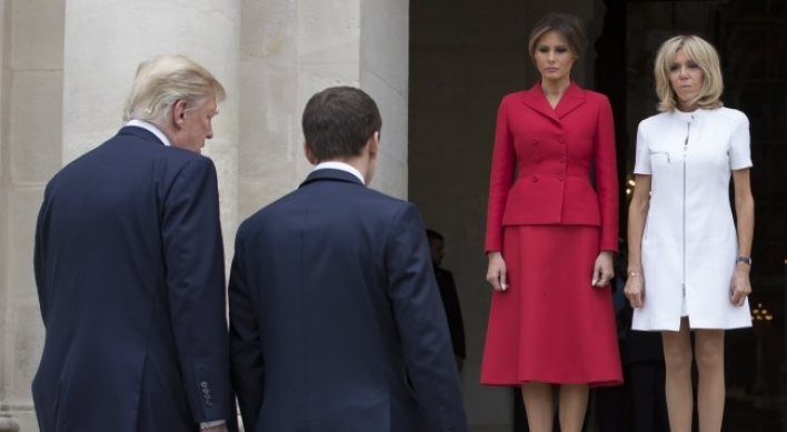 Trump caught on tape complimenting  Macron's wife's body