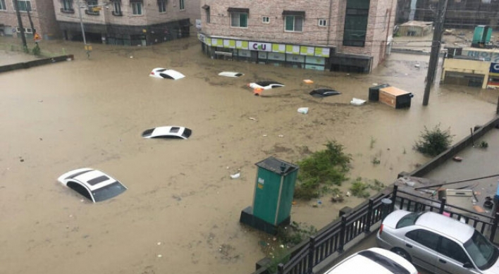 Heavy rain leaves at least 2 dead, 1 missing