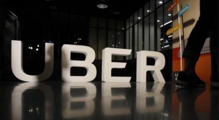 Uber, KB Financial team up for food delivery service in Korea