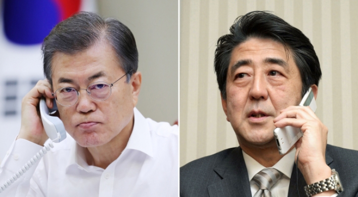 Moon, Abe agree to peaceful solution to North Korea’s provocations