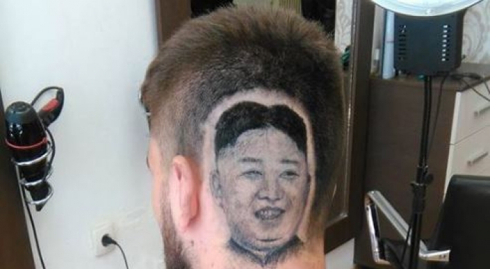 Serbian man shaves his head to enshrine N. Korean leader’s portrait