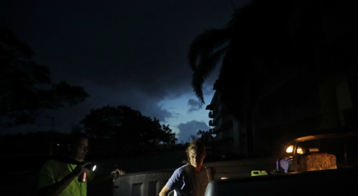 Now a tropical storm, Irma hits Florida with wind, flooding