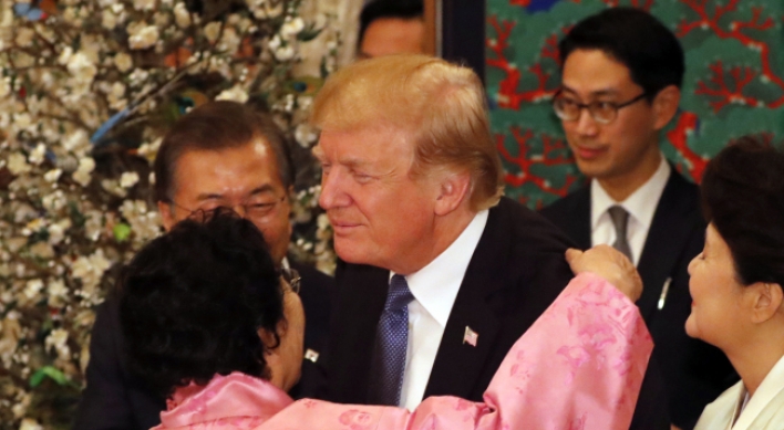 Trump’s hug with comfort woman draws ire from Japan