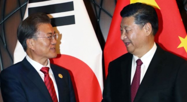 Moon due in China for summit with Xi over N. Korea, bilateral ties