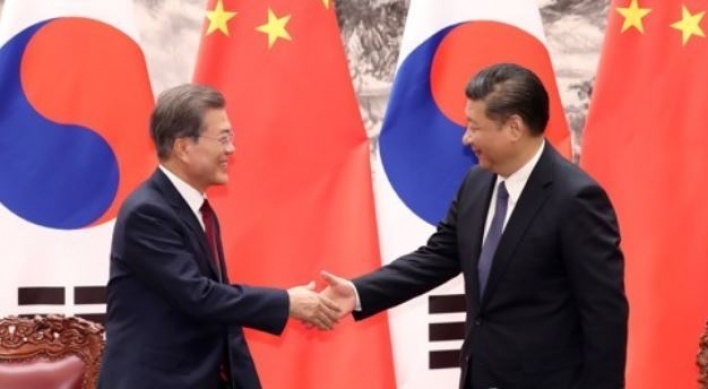 Moon returns home after summit with China's Xi over N. Korea, bilateral ties