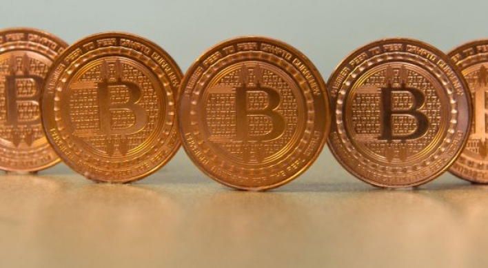 UBS boss says bitcoins 'not money', urges regulators to act