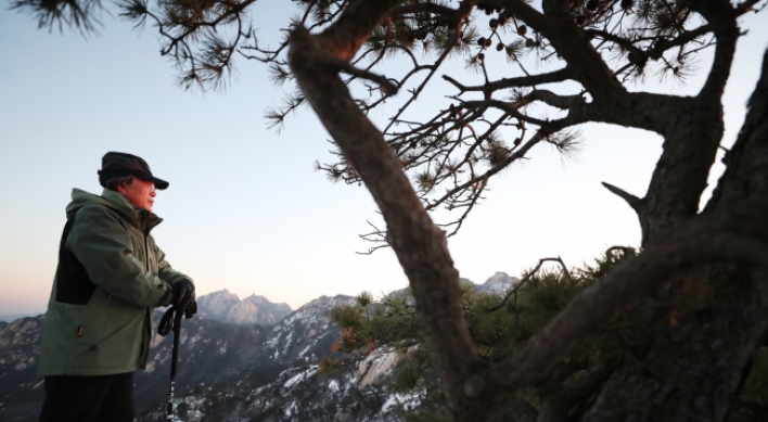 Moon opens new year with mountain hike