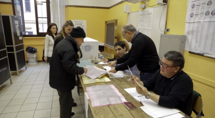 Italy votes in uncertain election stalked by populism