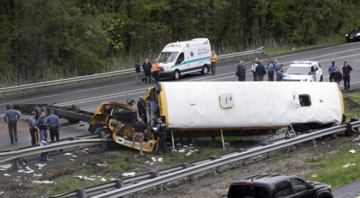 School bus torn apart in dump truck collision, killing 2