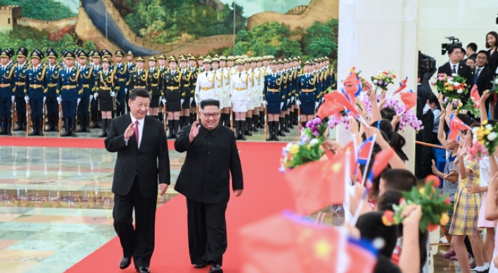 Kim, Xi discuss denuclearization, pledge closer cooperation