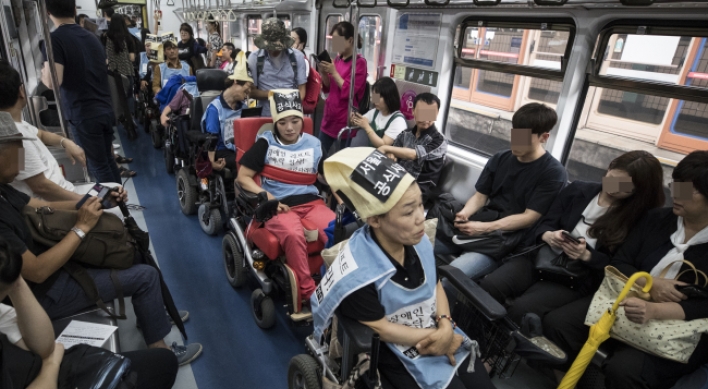 The disabled fight for right of mobility on Seoul subways