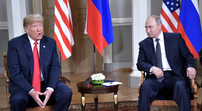 Trump, Putin sit down a bit late for closely watched summit