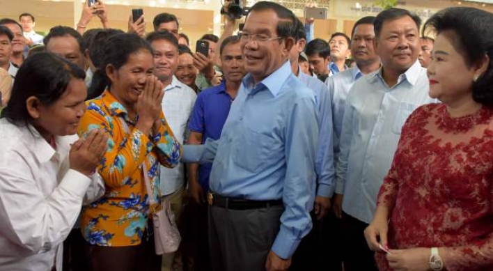 Cambodia ruling party claims 'huge victory' in vote decried as 'sham'