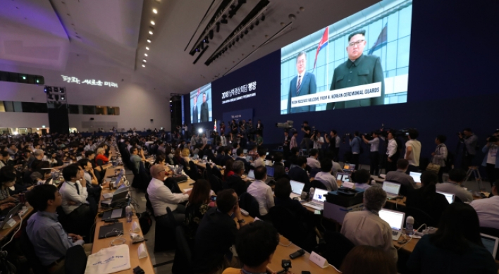 Journalists cover inter-Korean summit with measured excitement