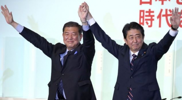 Japan’s Abe re-elected as party head, to stay on as PM