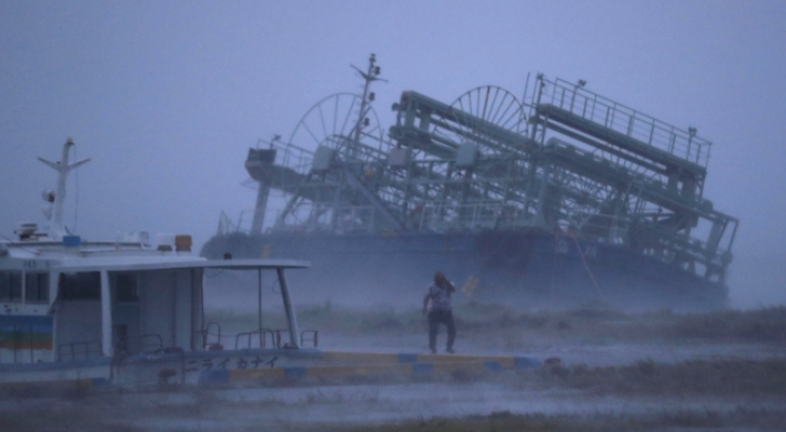 Typhoon pummels Japan; flights canceled, trains shut down