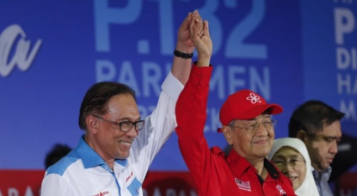 Malaysian PM rallies for successor and former foe Anwar