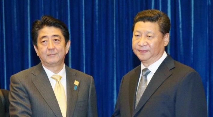 Japan's Abe in China as two nations try to mend ties