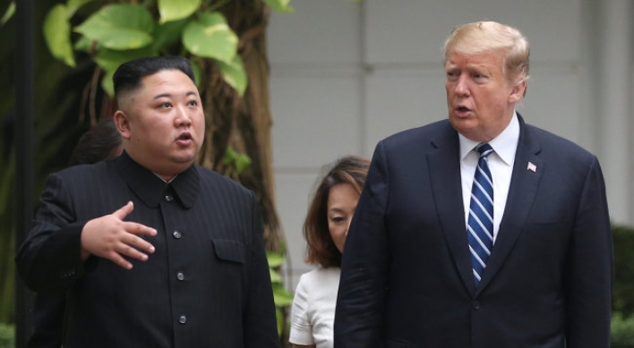 Kim, Trump seen strolling on hotel grounds