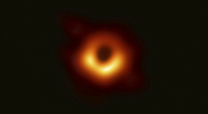 Astronomers unveil the first photo of a black hole