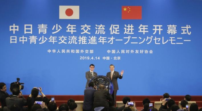 China, Japan tout 'recovered' ties amid global uncertainty