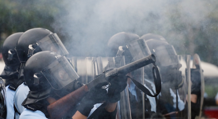 Hong Kong police use tear gas as protesters try to storm parliament