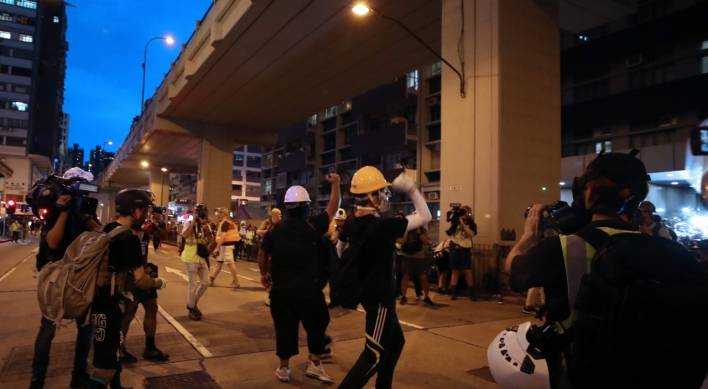 Defiant Hong Kong protesters vow huge rally despite Beijing threats