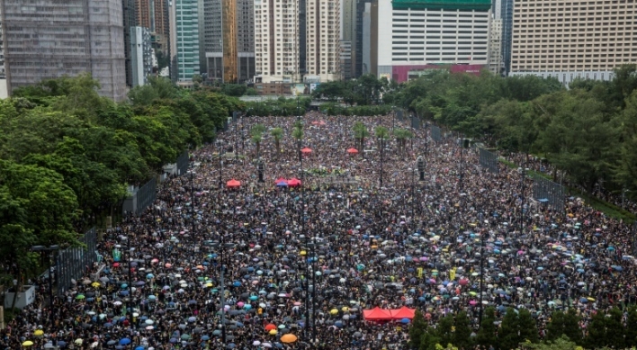 Hong Kong protesters flood city streets in 'peaceful' march
