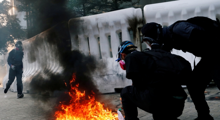 Violence flares after Hong Kong protesters defy police ban