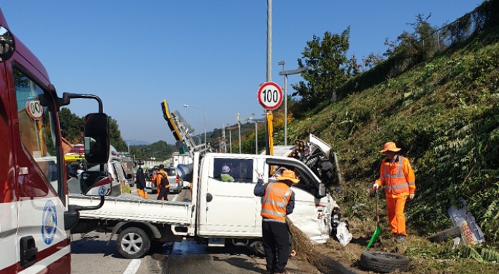 Three workers cutting grass killed after expressway truck collision