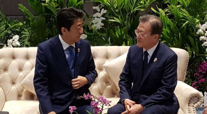 Moon, Abe agree to seek resolution to trade issues