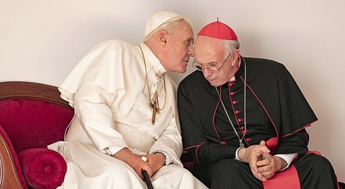 [Herald Review] Two’s company: Hopkins and Pryce enliven papal buddy film ‘The Two Popes’