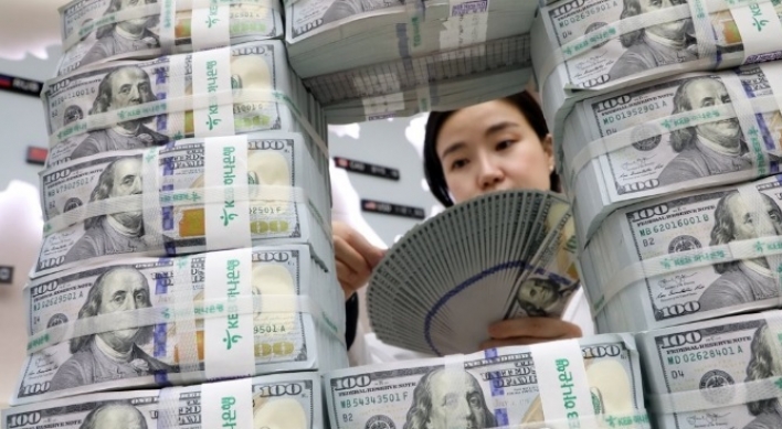 Foreign deposits rise on weak dollar in Dec.