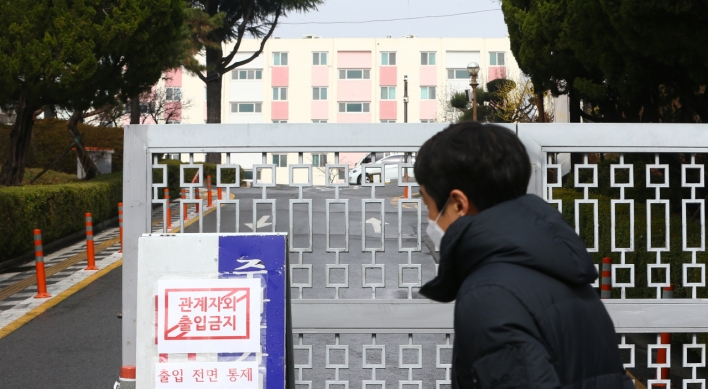 Virus-hit apartment under isolation, most cases linked to Shincheonji