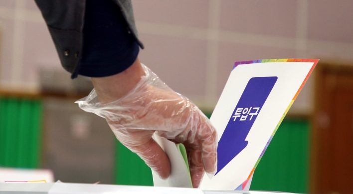 S. Koreans vote amid coronavirus outbreak with higher turnout than before