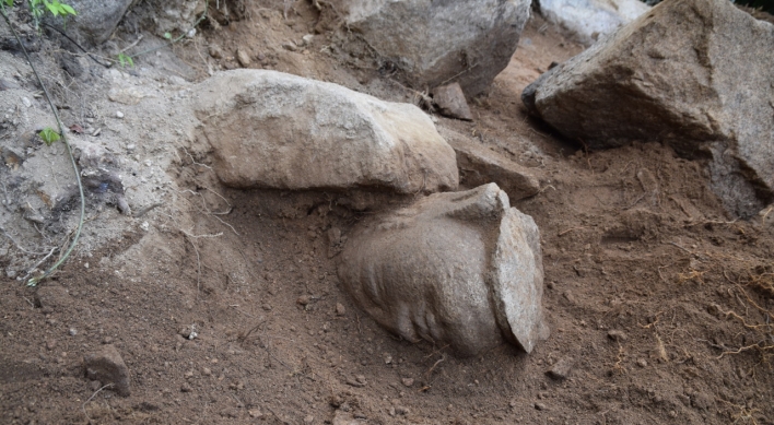 Missing head of Buddha statue on Namsan in Gyeongju discovered