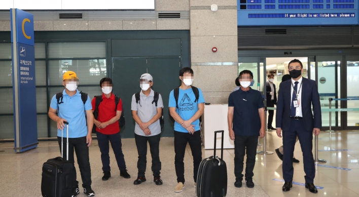 Five S. Korean sailors return home one month after release from captivity in Africa