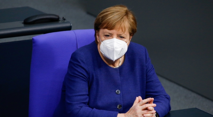 Merkel urges tougher curbs as virus deaths soar