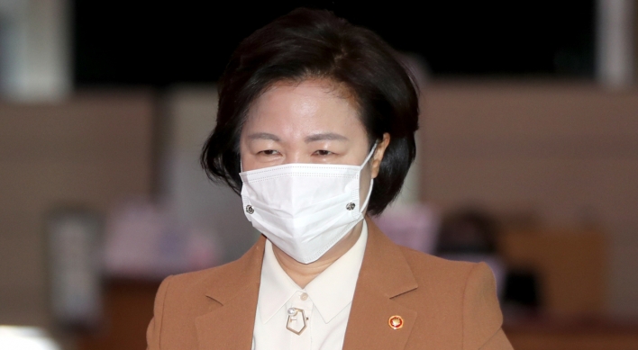 Justice minister apologizes over massive virus outbreak at detention center