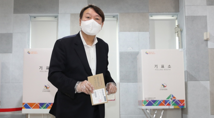 Yoon casts early ballot, fans speculations of political career