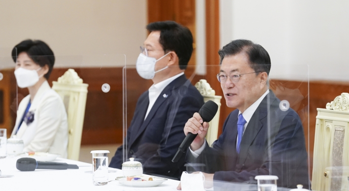 Moon seeks close teamwork with ruling party in his final year in office