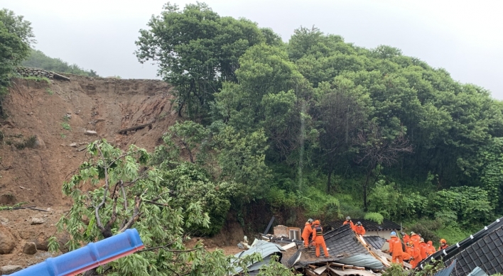 Downpours trigger landslide, cut off power, leave 2 dead in southern parts of Korea