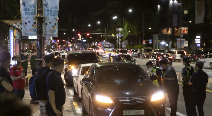 Hundreds of merchants hold late night drive-through rally against COVID-19 restrictions
