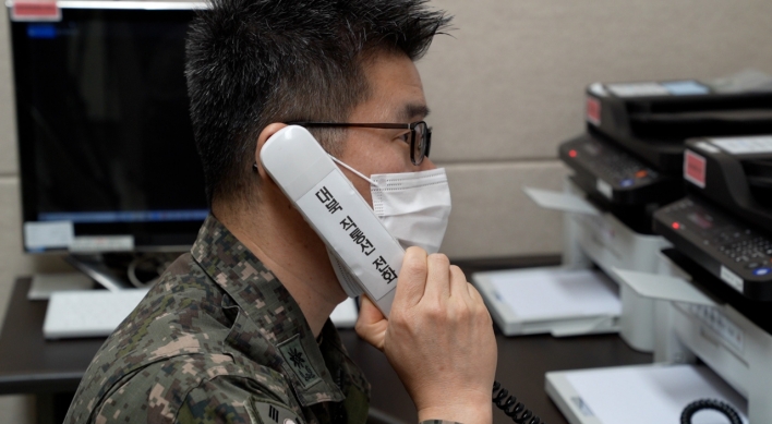 Two Koreas hold daily liaison, military calls after restoring communication lines