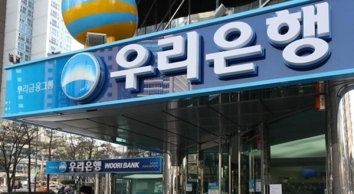 Woori Bank employee turns himself in after embezzling W50b of company funds: police