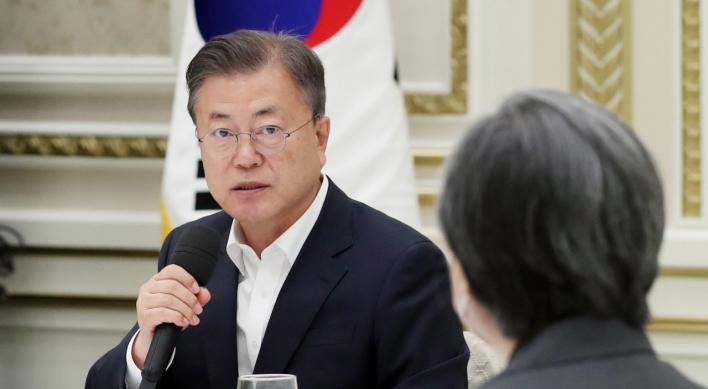 Moon thanks workers for dedication in fight against virus on Labor Day